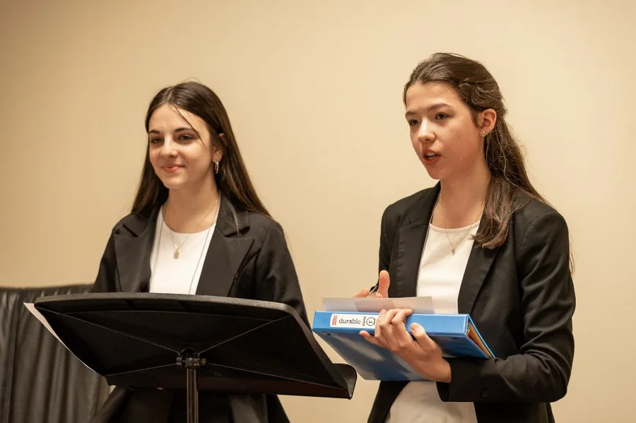 Two Wavemakers students presenting a case at an NCFCA debate round